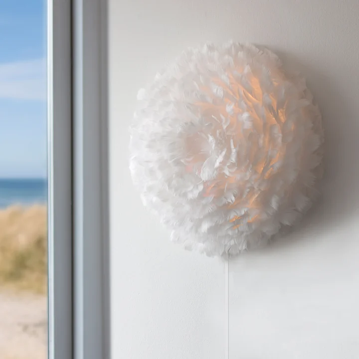 Eos Up Decken- und Wandleuchte von Umage in Créme an der Wand